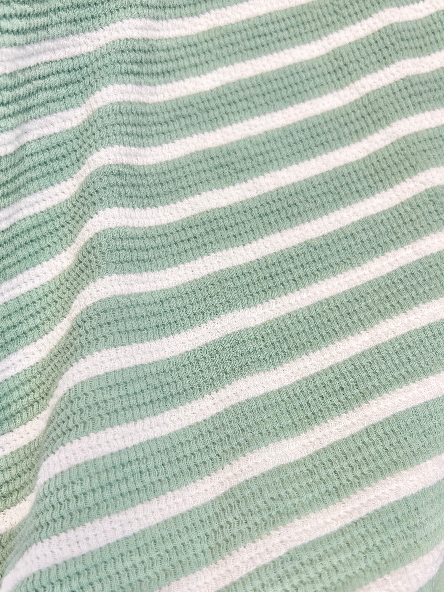 Close-up of Stylive By Your Side Top in sage green and white featuring horizontal stripes and textured waffle knit fabric.