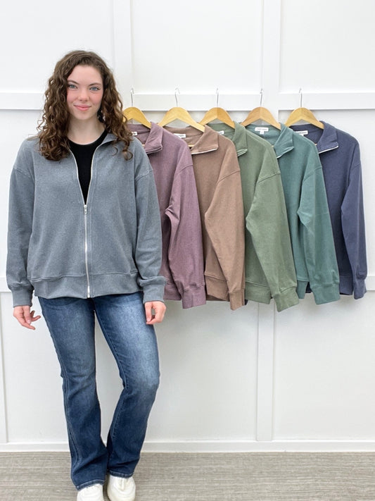 Women's relaxed fit zip-up jacket in charcoal gray with a collared neckline, long sleeves, and multiple color options.