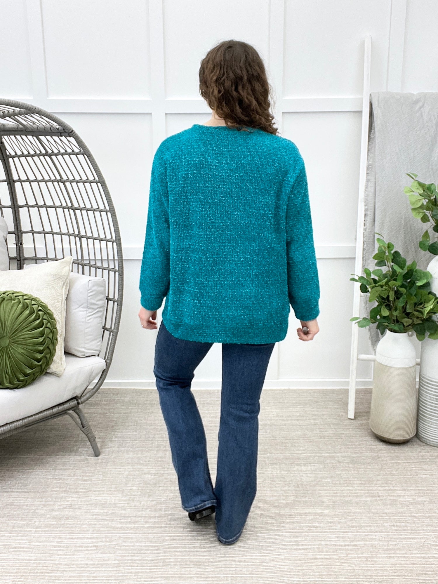 Back view of Dear Scarlett Daydream Daze sweater in Teal Glow featuring a fuzzy textured knit, long sleeves, and relaxed fit.